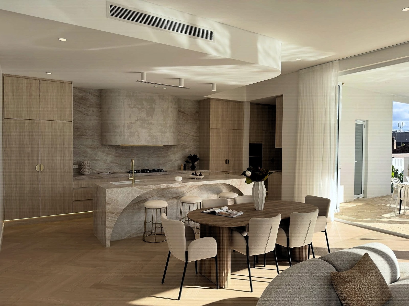 Open-plan kitchen, dining and living area with herringbone oak flooring throughout